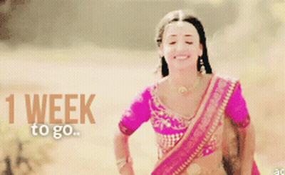 Woman In Pink Top Smiling 1 Week To Go GIF