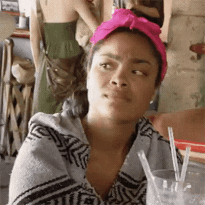 Woman In Pink Turban With Glass Of Water And Straws GIF
