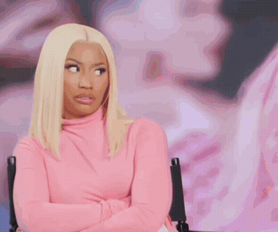 Woman In Pink Turtleneck Arms Crossed GIF