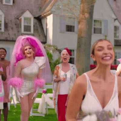 Woman In Pink Veil And Gloves Laughing GIF
