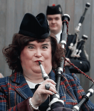 Woman In Plaid And Man Playing Bagpipes GIF