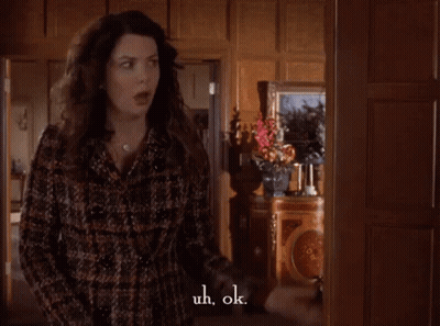 Woman In Plaid Coat Saying Uh Ok GIF