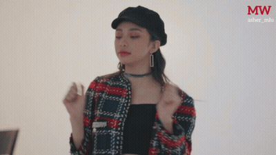 Woman In Plaid Jacket And MW Hat GIF