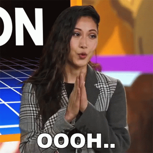 Woman In Plaid Jacket Saying Oooh GIF