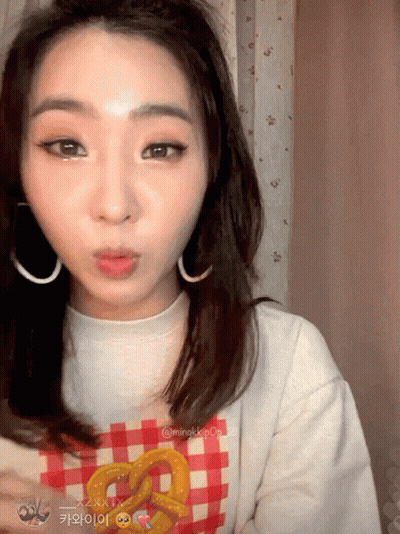 Woman In Plaid Pretzel Shirt Making Face GIF