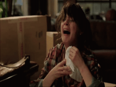 Woman In Plaid Shirt Crying With Napkin GIF