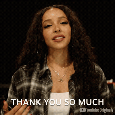 Woman In Plaid Shirt Giving Thank You So Much Sign GIF