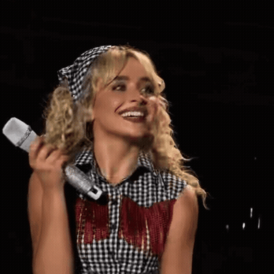 Woman In Plaid Shirt Holding Microphone GIF
