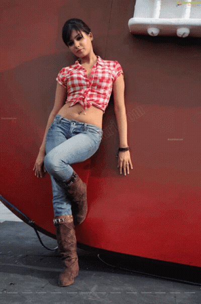 Woman In Plaid Shirt Leaning Against Wall GIF