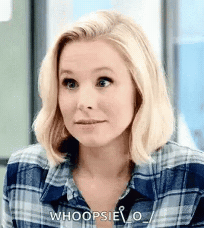 Woman In Plaid Shirt Making Funny Face GIF