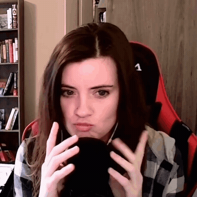 Woman In Plaid Shirt On Red Chair Number 1 GIF