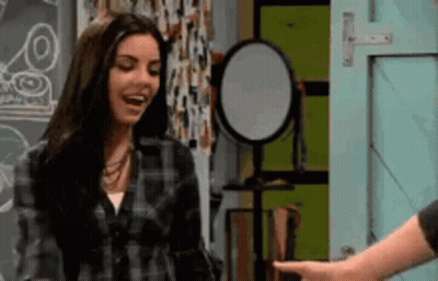 Woman In Plaid Shirt Pointing At Man GIF