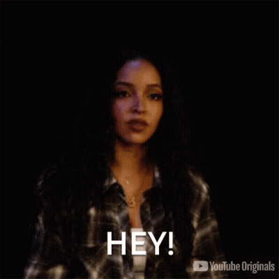 Woman In Plaid Shirt Saying Hey GIF