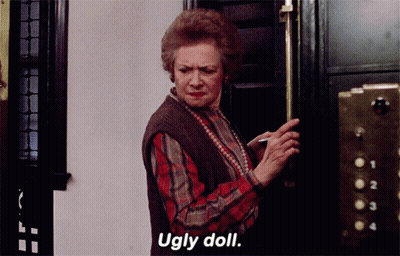 Woman In Plaid Shirt Saying Ugly Doll GIF