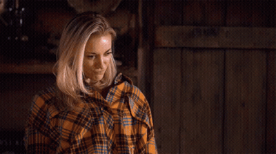 Woman In Plaid Shirt Standing By Sign You Are Thriving Girl GIF