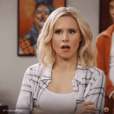 Woman in Plaid Shirt Surprised With Open Mouth