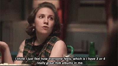 Woman In Plaid Shirt Talking To Another Woman GIF