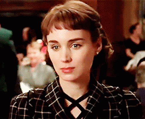 Woman In Plaid Shirt With Crisscross Neckline GIF