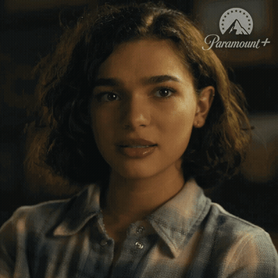 Woman In Plaid Shirt With Paramount Logo GIF