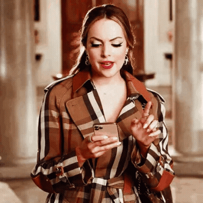Woman In Plaid Trench Coat Holding Cell Phone GIF