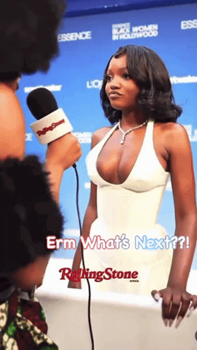 Woman In Plunging White Dress Interviewed By Rolling Stone Reporter GIF