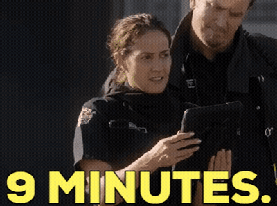 Woman In Police Uniform And Man Looking At Tablet GIF