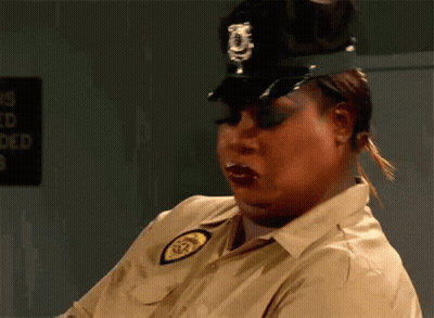Woman In Police Uniform Making Funny Face GIF