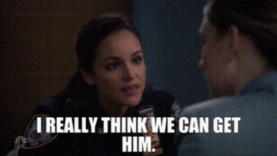 Woman In Police Uniform Talking To Man In Prison Cell GIF