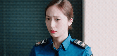Woman In Police Uniform With Red Lipstick GIF
