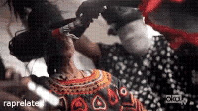 Woman In Polka Dot Dress Getting Hair Done GIF
