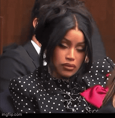 Woman In Polka Dot Dress Held By Man GIF