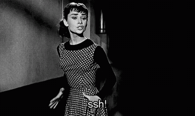Woman In Polka Dot Dress In Dark Room GIF