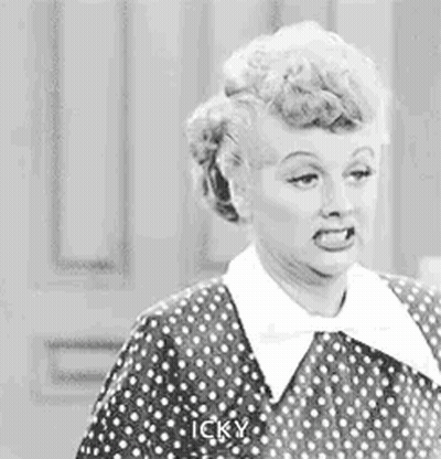Woman In Polka Dot Dress Making Funny Face GIF