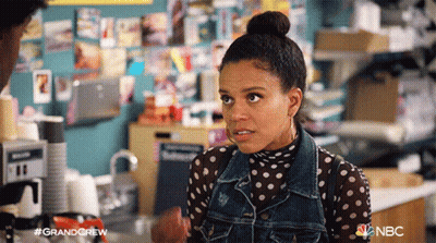Woman In Polka Dot Shirt And Denim Jacket GIF