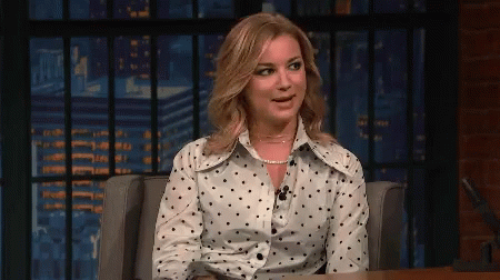 Woman In Polka Dot Shirt Sitting GIF