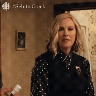 Woman In Polka Dot Shirt With Schitts Creek GIF