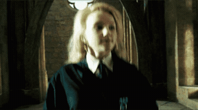 Woman In Ponytail With Head In Hands On Soccer Field GIF
