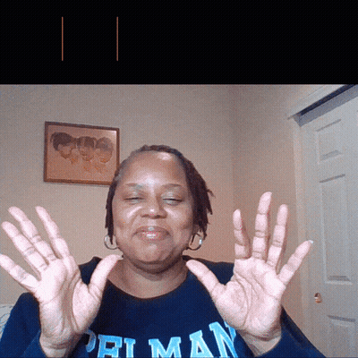 Woman In Priman Shirt Holding Hands Up GIF