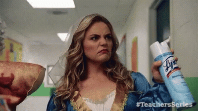 Woman In Princess Costume Holding Lysol Spray GIF