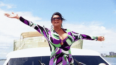 Woman In Purple And Green Dress On Boat GIF