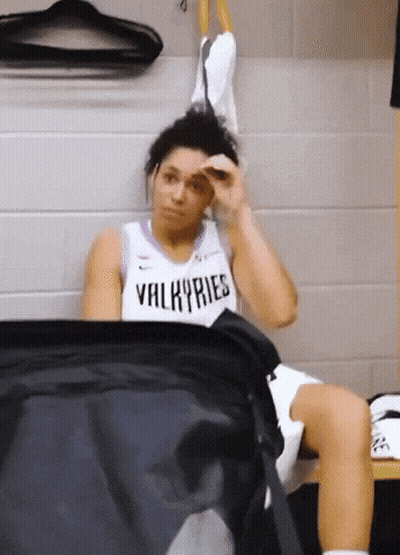 Woman In Purple And White Valkyries Tank Top GIF