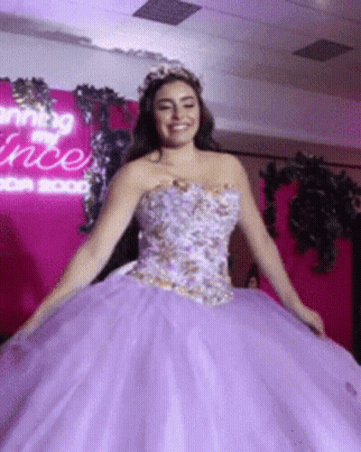 Woman In Purple Ball Gown Smiling GIF