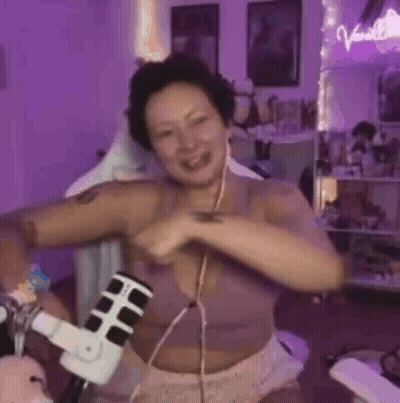 Woman In Purple Bra Dancing At Microphone GIF
