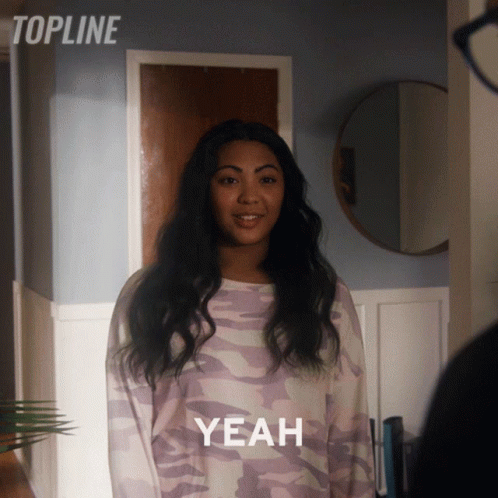 Woman In Purple Camo Sweater Says Yeah GIF