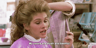 Woman In Purple Cape Getting Hair Dyed GIF