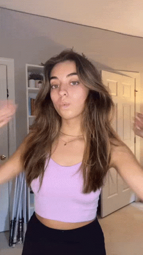 Woman In Purple Crop Top Standing GIF