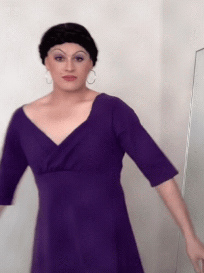 Woman In Purple Dress And Black Wig Mirror GIF