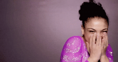 Woman In Purple Dress Covering Face Laughing GIF