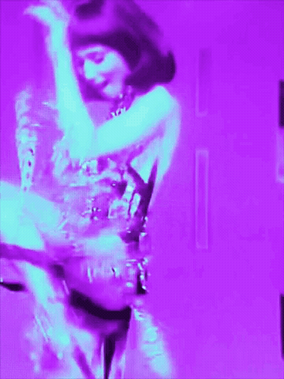 Woman in Purple Dress Dancing