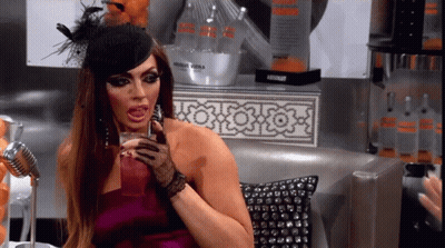 Woman in Purple Dress Holding Absolut Vodka